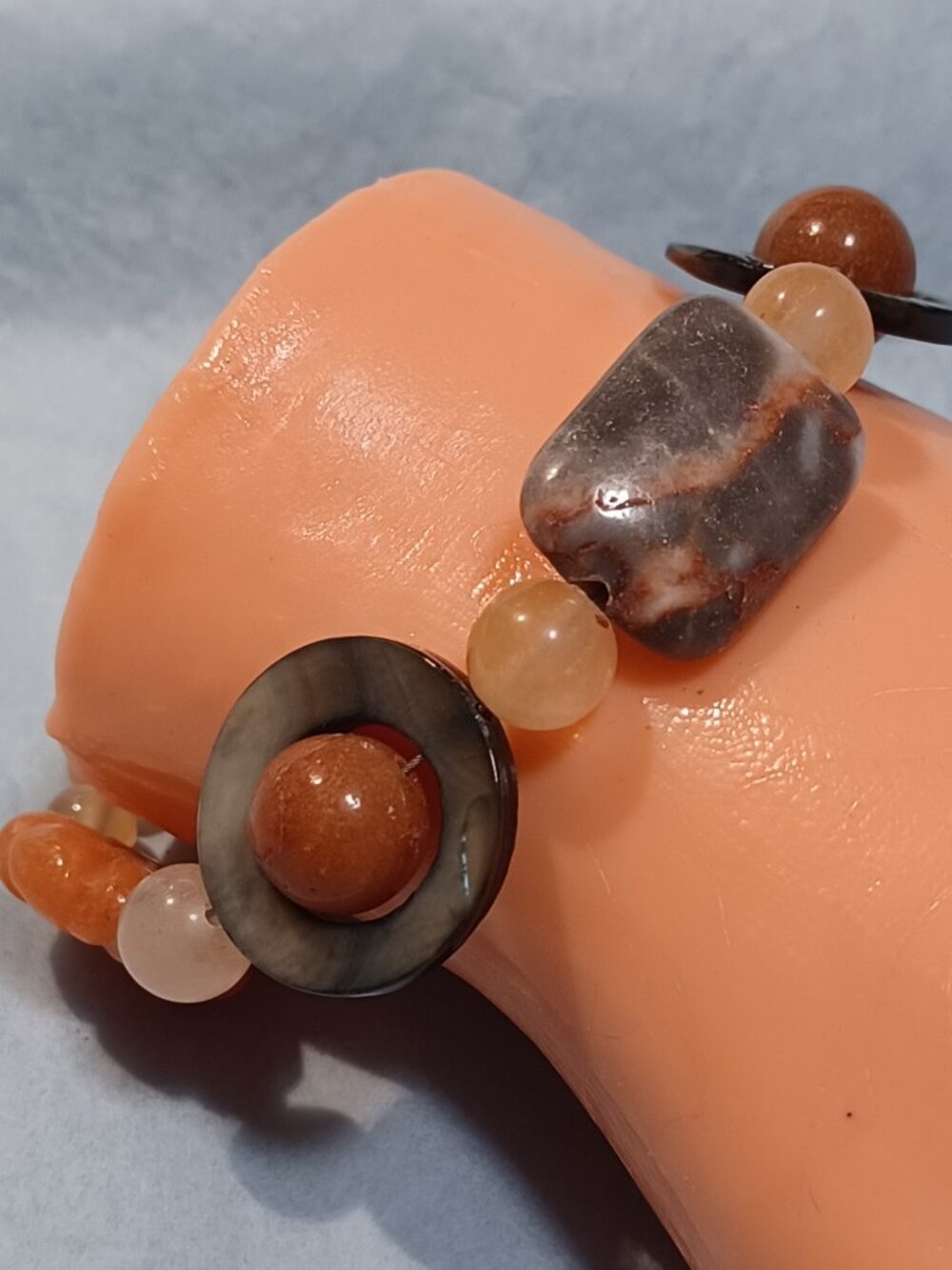 Beautiful MOP Circle Cut-outs & Carved Orange Aventurine bracelet